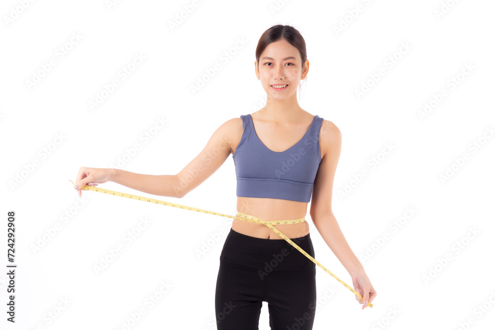 Portrait beautiful young asian woman measure tape with waist for weightloss with satisfied isolated white background, female in sportswear slimming shape with workout, sport and health care concept. Portrait beautiful young asian woman measure tape with waist for weightloss with satisfied isolated white background, female in sportswear slimming shape with workout, sport and health care concept.