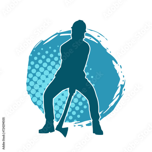 Silhouette of a worker in action pose using his axe tool.