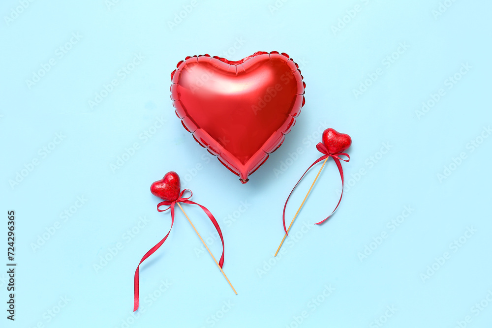 Heart shaped air balloon and beautiful decorations on blue background. Valentine's day celebration