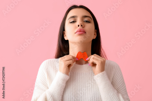 Young woman with paper thyr...