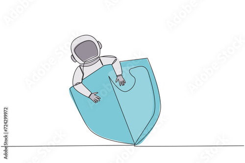 Single continuous line drawing young energetic astronaut hugging shield. Request additional protection to make expeditions in space safer. Cosmic galaxy deep space. One line design vector illustration