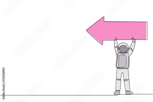 Single one line drawing young energetic astronaut lift the arrow-shaped puzzle. Teamwork by telling the direction where the spacecraft lands. Cosmonaut. Continuous line design graphic illustration