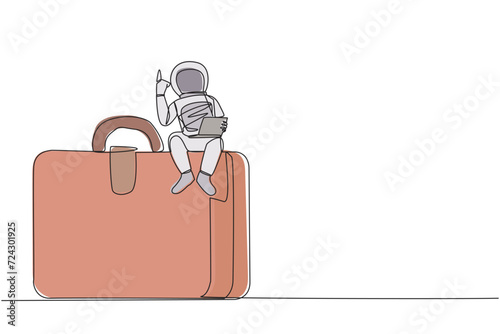 Single continuous line drawing young energetic astronaut sitting on giant briefcase holding laptop raise one hand. The first expedition to the surface of Mars. One line design vector illustration photo