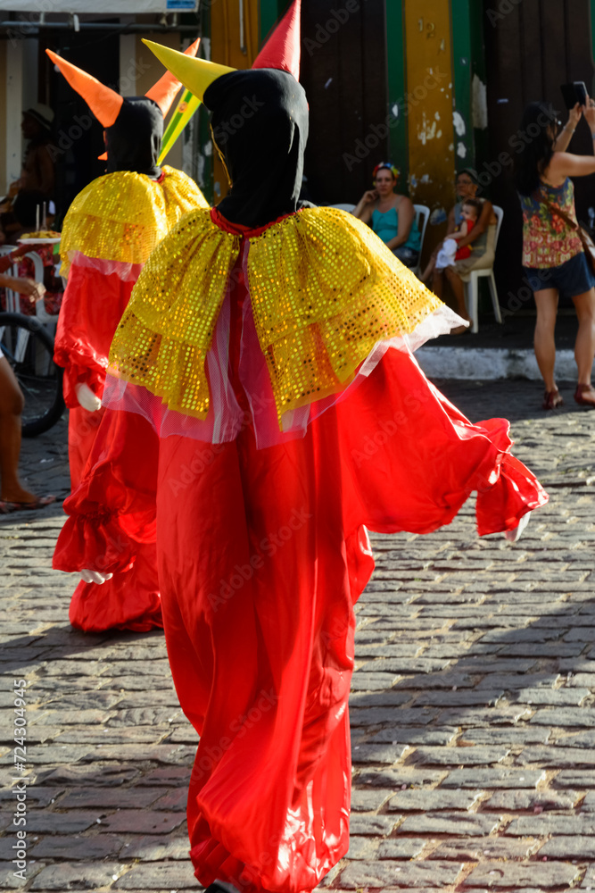 People wearing venice carnival costumes during festivities People wearing venice carnival costumes during festivities