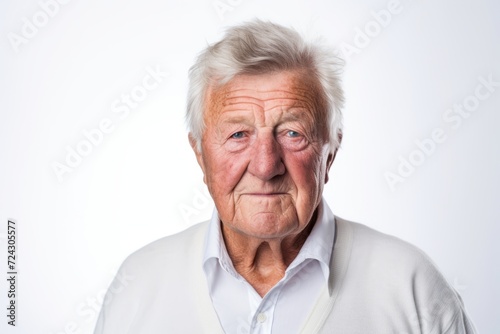 Portrait of a senior man looking at camera. Isolated on white background