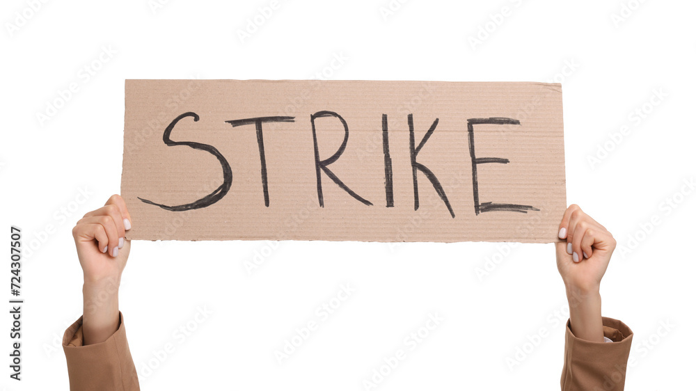 Woman holding cardboard banner with word Strike on white background, closeup Woman holding cardboard banner with word Strike on white background, closeup