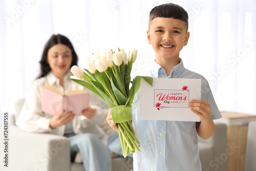 Cute little boy with tulips...