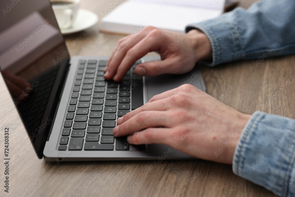E-learning. Man using laptop during online lesson at table indoors, closeup E-learning. Man using laptop during online lesson at table indoors, closeup