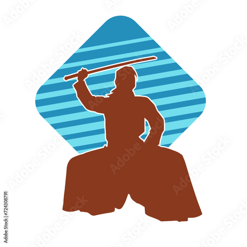 Silhouette of a sword warrior in action pose. Silhouette of a martial art person carrying sword weapon. Silhouette of kendo martial art pose.
