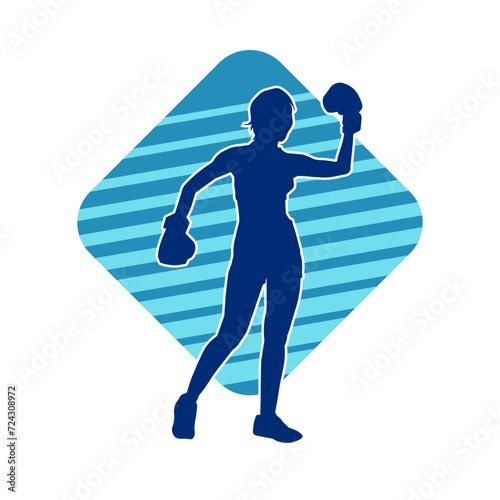 Silhouette of woman boxing athlete in action pose. Silhouette of a female wearing boxing gloves for boxing sport.
