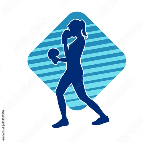 Silhouette of woman boxing athlete in action pose. Silhouette of a female wearing boxing gloves for boxing sport.
