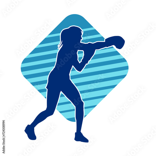 Silhouette of woman boxing athlete in action pose. Silhouette of a female wearing boxing gloves for boxing sport.
