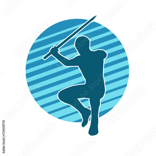 Silhouette of a male warrior in action pose with sword weapon. Silhouette of a man fighter carrying sword weapon.