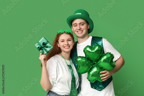 Young couple with gift and ...
