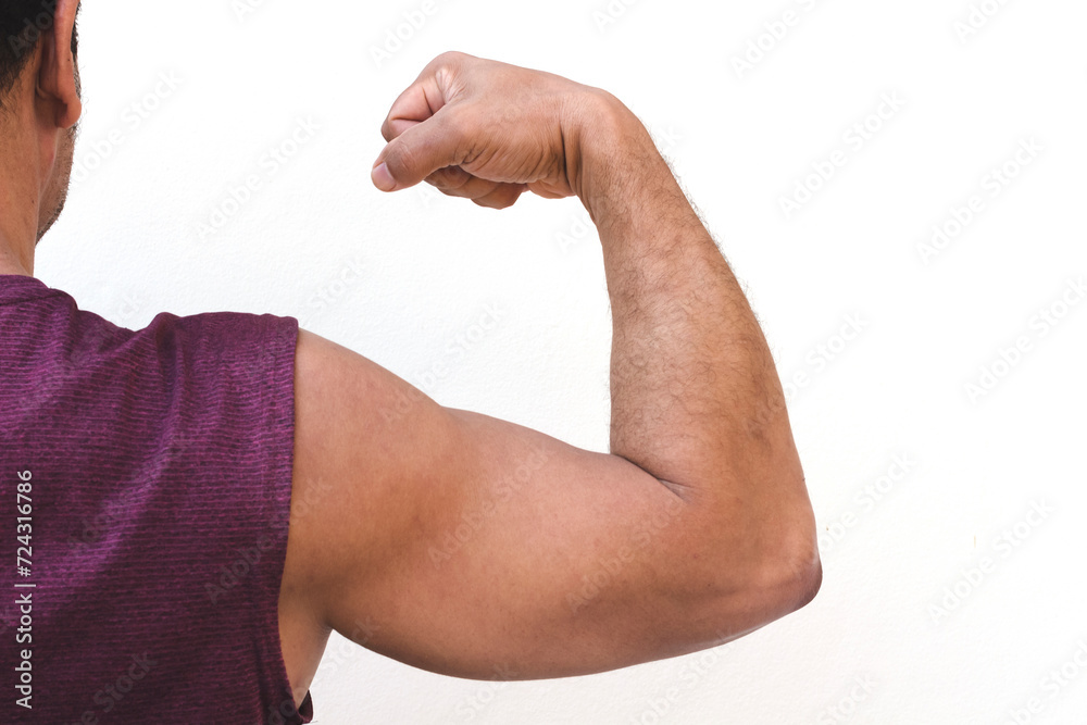 middle-aged man showing off his strong back arms. middle-aged man showing off his strong back arms.