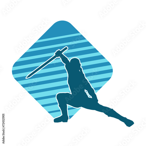 Silhouette of a male warrior in action pose with sword weapon. Silhouette of a man fighter carrying sword weapon.