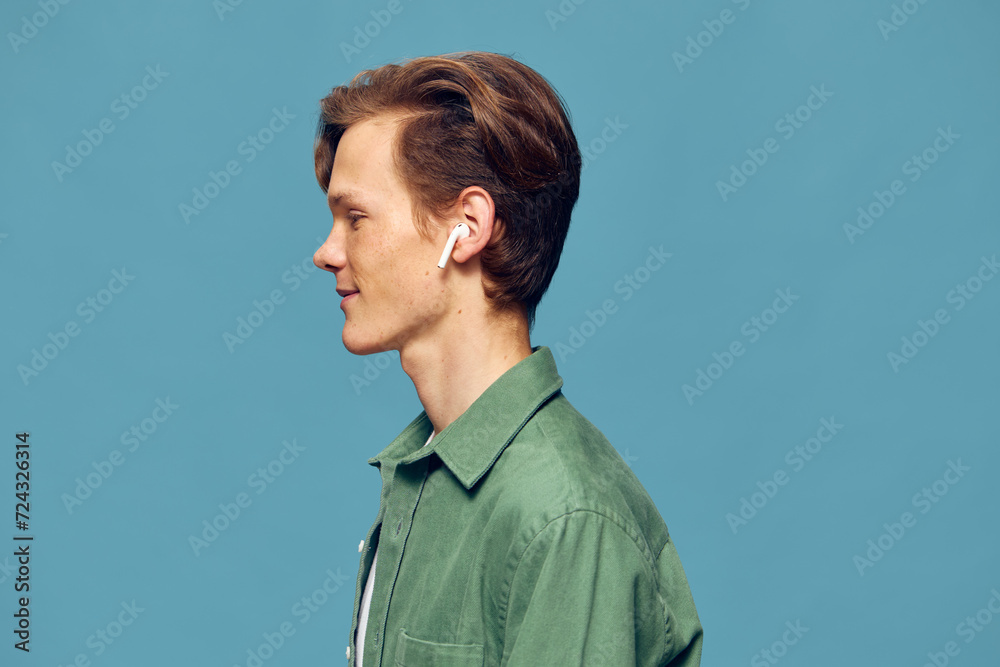 The Handsome Blue-Eyed Model: Portrait of a Confident Young Man in Casual White Shirt The Handsome Blue-Eyed Model: Portrait of a Confident Young Man in Casual White Shirt