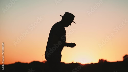 silhouette of a person observing on the sunset