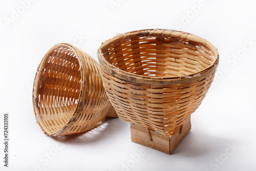 Bamboo basket for serving snacks with a traditional theme photo