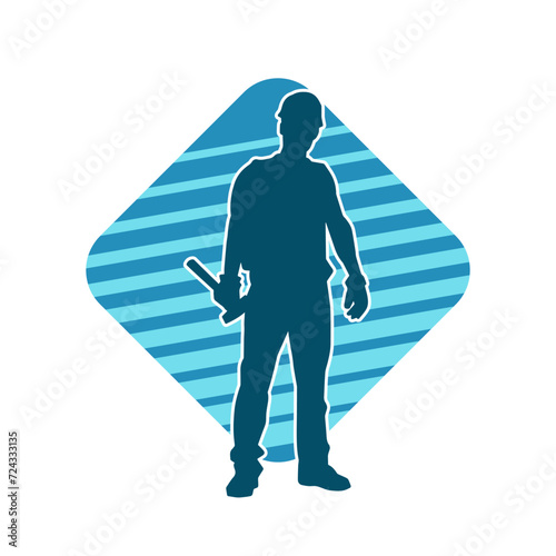 Silhouette of a worker carrying hammer tool. Silhouette of a worker in action pose using hammer tool.