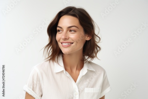 Portrait of beautiful young woman smiling, looking at camera and smiling.