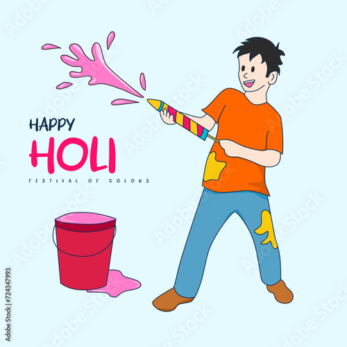 The essence of Holi captured in a boy's gleeful act of throwing colors into his pichkari, setting the stage for a vibrant and festive celebration