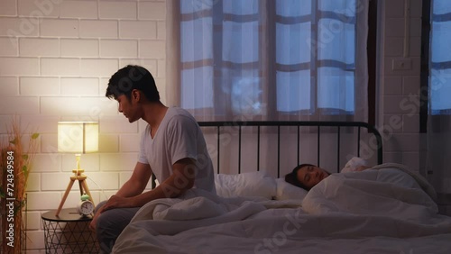 Asian young couple on bed. depression and erectile dysfunction. Man and woman with stress, sex problems or anxiety in relationship difficulties. Marriage and divorce problem concept photo