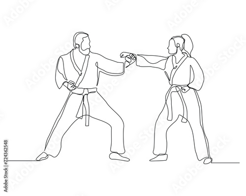 Continuous single line sketch drawing of young man and woman confident karateka in kimono practicing fight karate combat. One line traditional martial art sport training concept Vector illustration