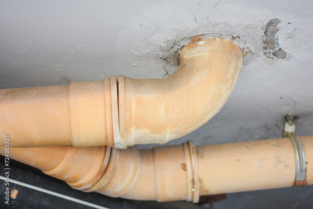 Yellow sewer pipe under the building Yellow sewer pipe under the building