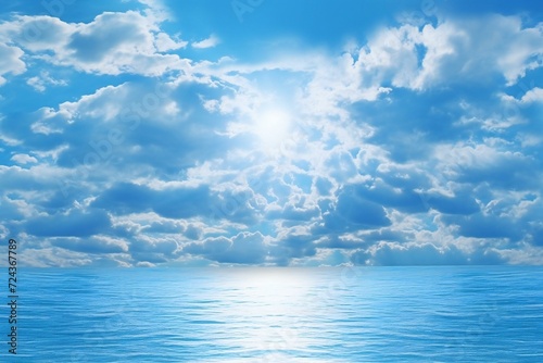 Blue sea and sky with clouds reflected in water