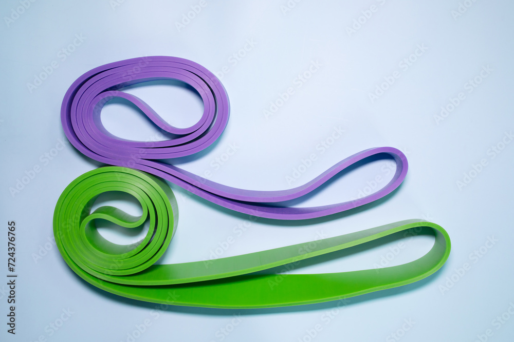 Fitness elastic band for sport isolated on blue background. Fitness elastic band for sport isolated on blue background.