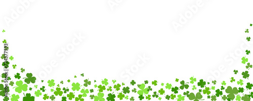 St. Patrick Day shamrock clover background. Vector border with flying green leaves for posters banners and greeting cards.