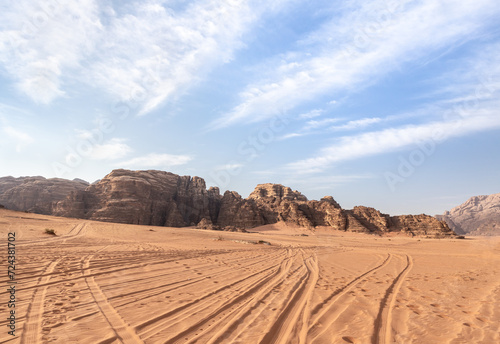 Jeep tracks across the endless sandy red desert of the Wadi Rum near Amman in Jordan