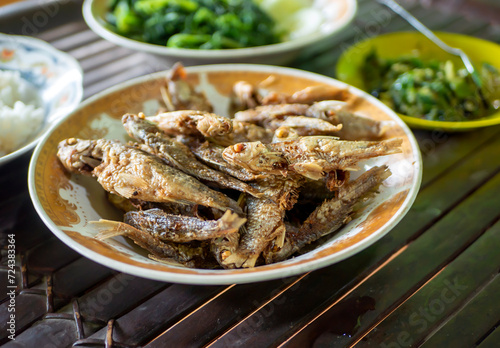 Fried fish with rice and vegetables on, ndonesian cuisine, Indonesian food