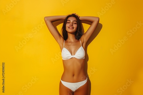 Sexy Woman Posing in a White Bikini on a Bold Yellow Background. Generative AI.