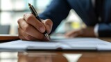 Businessman use elegant pen to signing contract in modern office