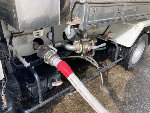 Hose connected to water tanker