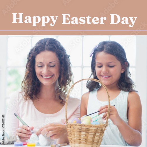 Composition of happy easter day text over caucasian mother and daughter colouring eggs