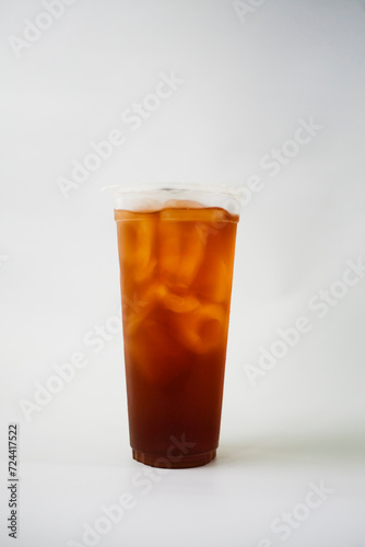 Take away iced tea in plastic cup isolated on white background
