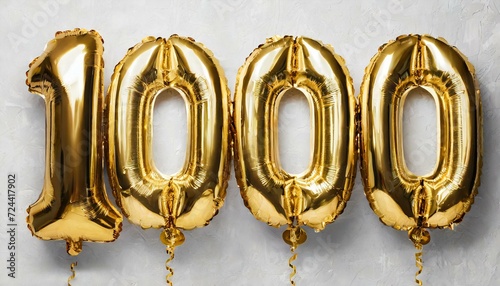 3d gold number 1000 , Helium balloons, Number 1000 one thousand made of golden inflatable balloons isolated on white, gold foil numbers. Background Party decoration,gold rings on white photo