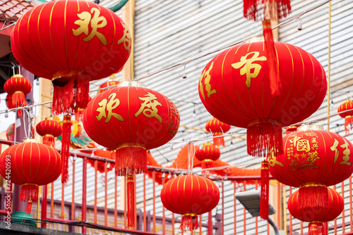 Many large red Chinese lanterns hang from the overpass. There are letters written to wish good luck on Chinese New Year  beautiful and outstanding. Ready to decorate during festivals and celebrations