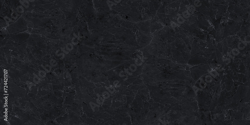 Close-up of black marble with intricate grey veins creating a luxurious stone texture