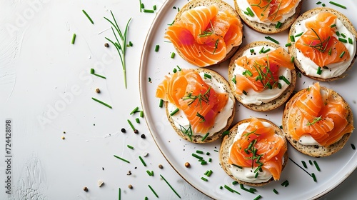 Hors d'oeuvres of salmon and crackers with sour cream and chives against a white backdrop, space, Generative AI.
