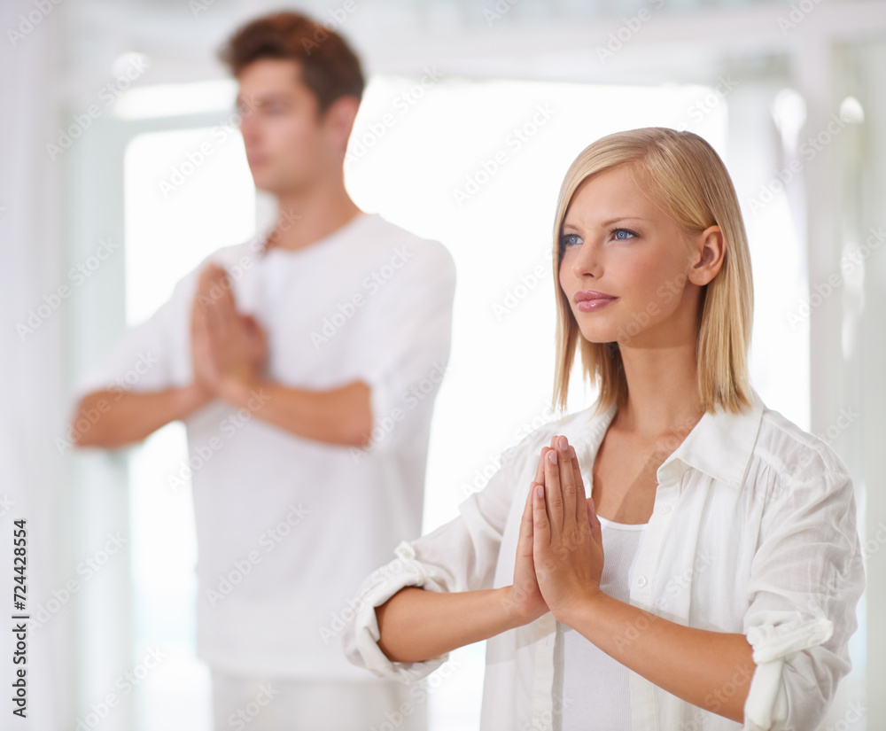 Obraz premium Meditation, prayer hands and people in a studio with peace, zen and mental health, wellness or balance. Mindfulness, relax and team with holistic, breathing or yoga exercise for spiritual awareness