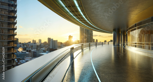 3D futuristic curved shapes design metal facade office exterior with stunning sunrise city skyline © jamesteohart