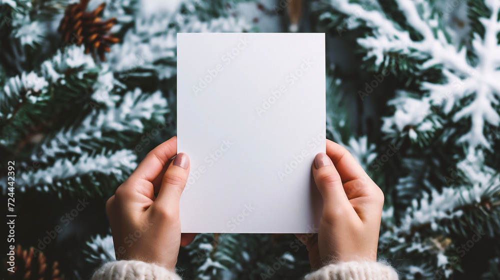 Female hands holding blank white paper sheet with copy space for text. Female hands holding blank white paper sheet with copy space for text.