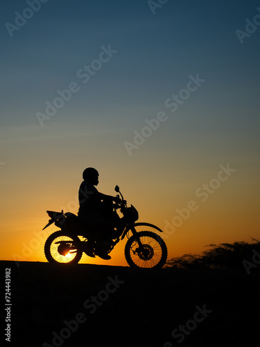 Motorcyclist at sunset