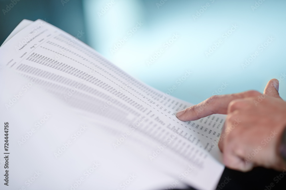 Hand, pointing at documents and numbers for finance, investment or business profit in corporate office. Accounting, person and paperwork for asset management, figures and reading stocks at workplace Hand, pointing at documents and numbers for finance, investment or business profit in corporate office. Accounting, person and paperwork for asset management, figures and reading stocks at workplace