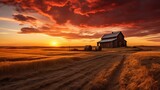 Rustic farm with granary and golden sky at sunset