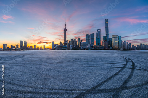 Asphalt road square and modern urban buildings scenery at sunrise in Shanghai